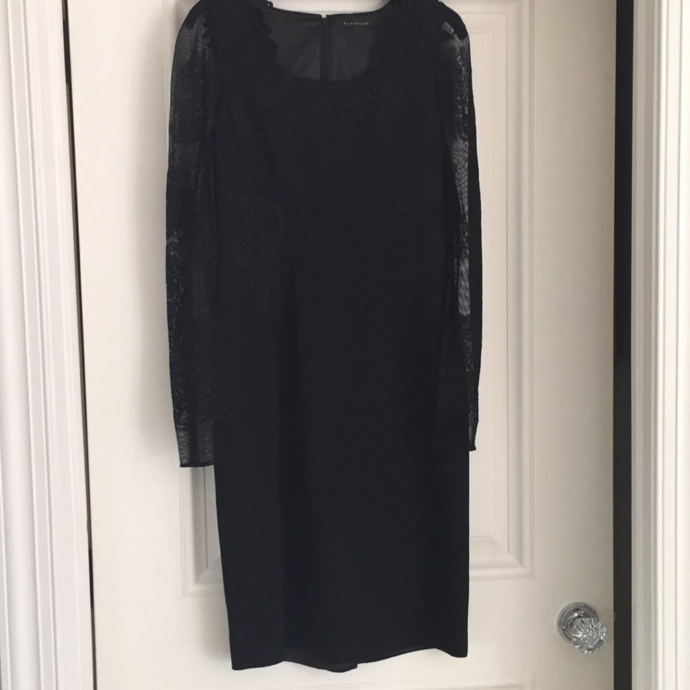 Wonderfully lace detailed black cocktail dress.